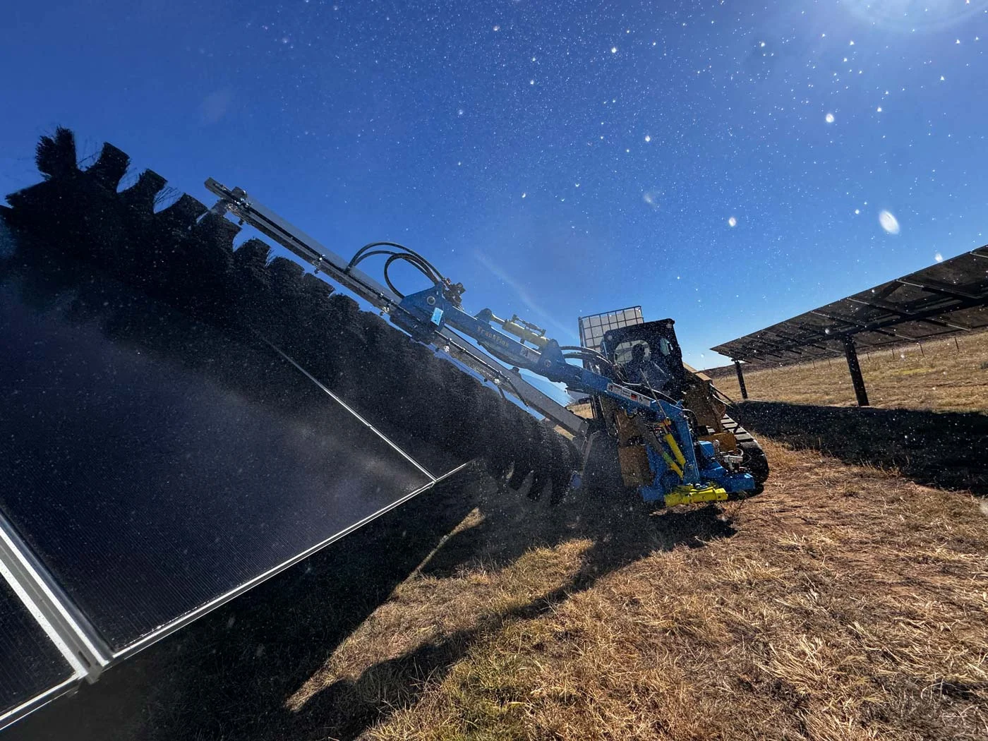 US-Solar-Cleaning-Photo2-1400px US Solar PV Module Cleaning Commercial Solar Panels Being Cleaned Using Our Proprietary PV Module Cleaning Process Moving Toward The Camera In A Field 1400px x 1050px