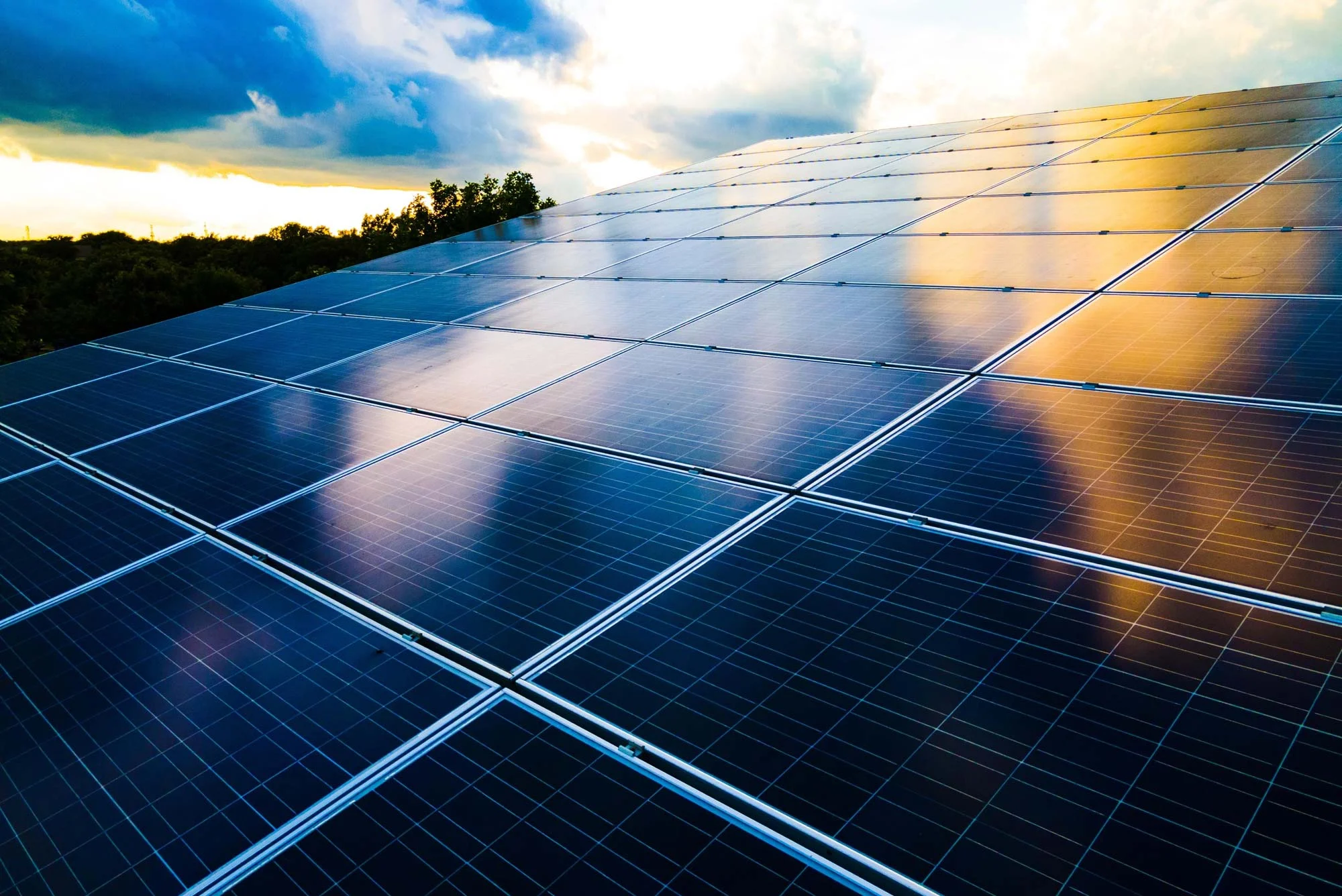 solar-panels-reflecting-sky-2000px US Solar PV Module Cleaning Solar Panels Reflecting The Sky At Sunset 2200px x 1336px
